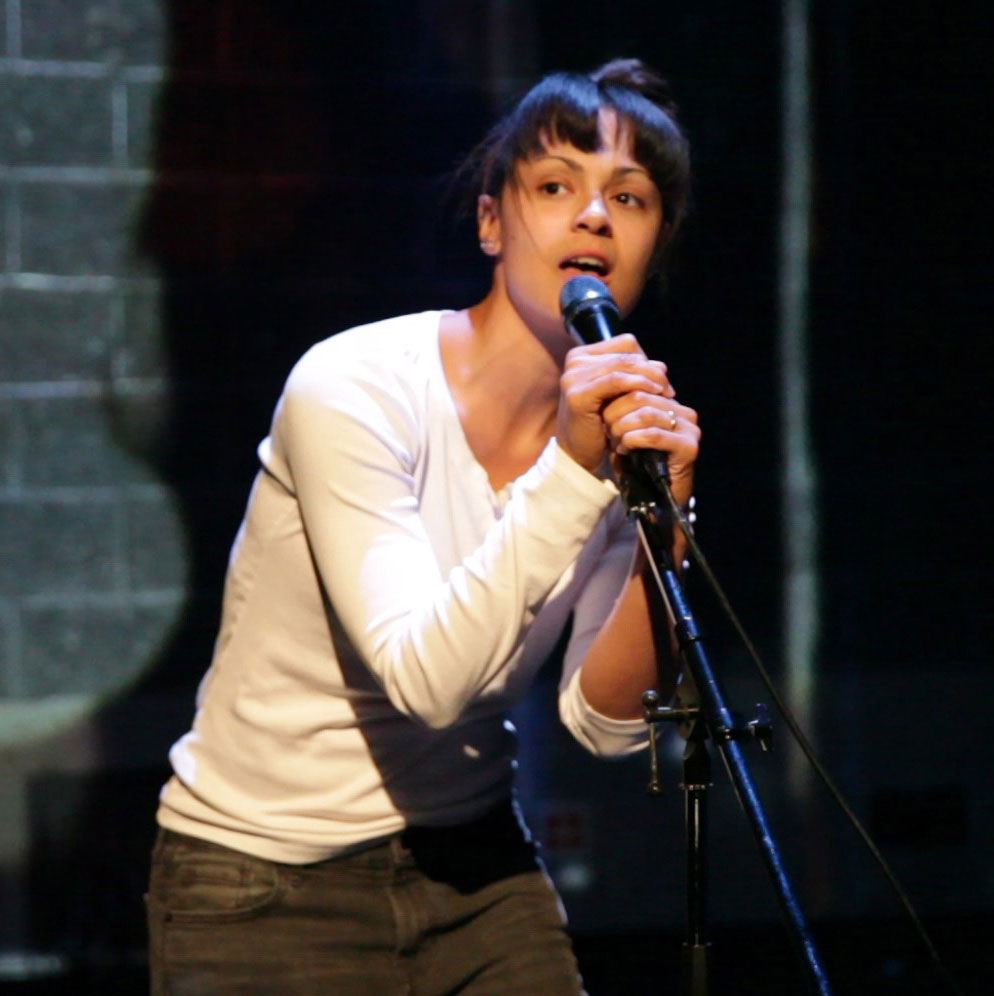 Amber Funk Barton sings into a microphone
