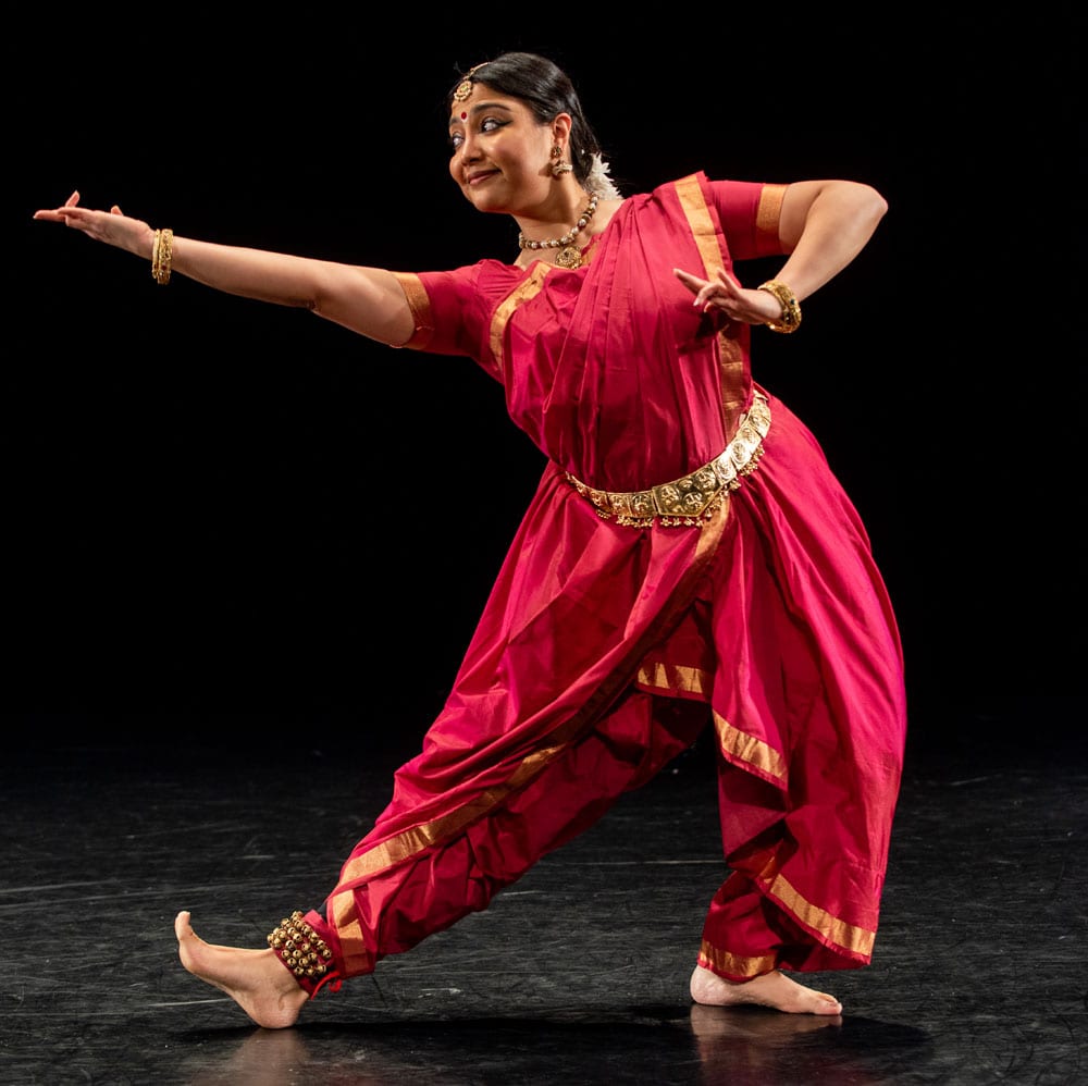 Dance artist Arno Kamolika poses mid performance